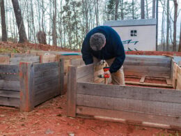 Building raised garden bed with a wooden frame.