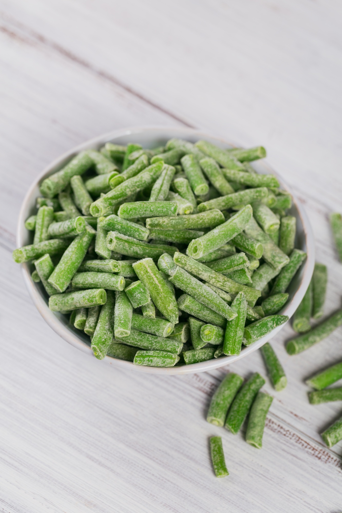 Cut green beans in bowl. Concept of homemade preparations for fast cooking