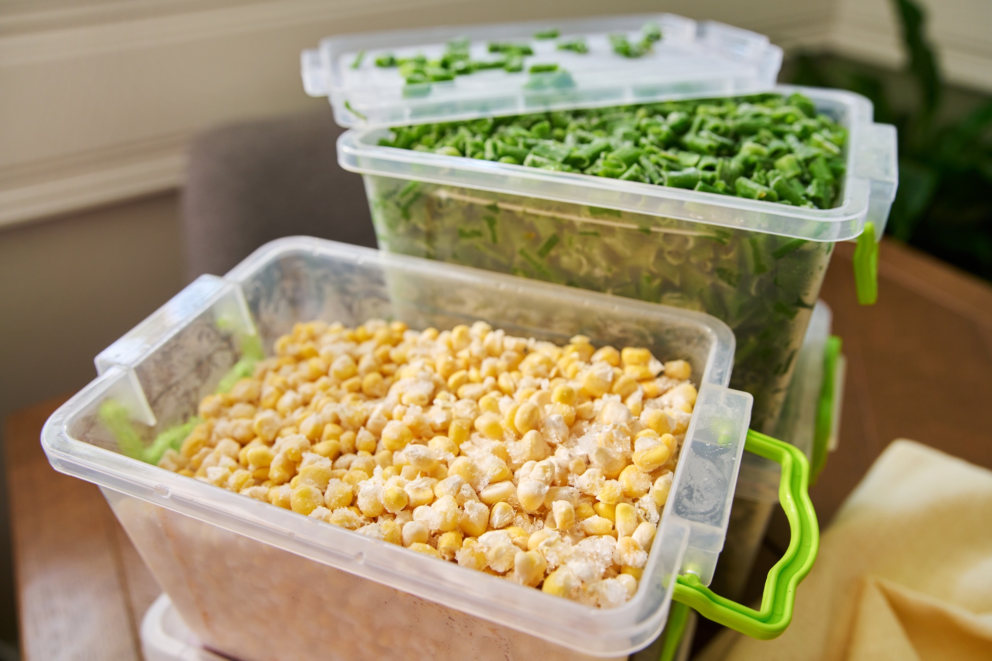 Frozen vegetables and fruits, close-up frozen green onions, corn
