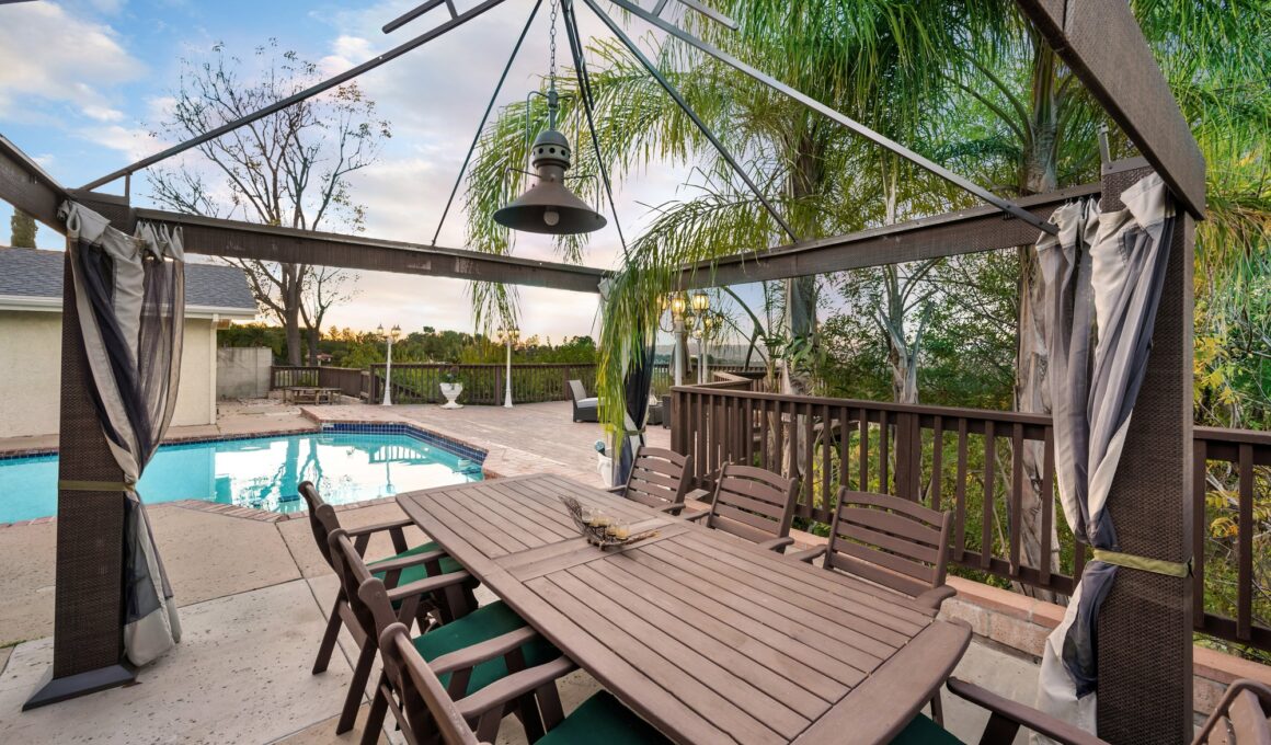 Backyard with a pool, patio, and gazebo in Encino, CA