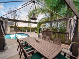 Backyard with a pool, patio, and gazebo in Encino, CA