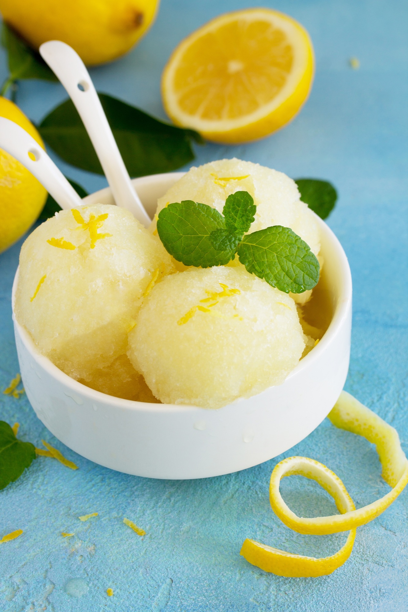 Homemade fresh fruit lemon sorbet ice cream in a white bowl.