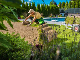 Man Restoring Backyard Garden Grass Turfs