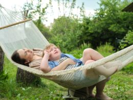 private oasis forms as a mother and her son find their comfort zone in a hammock, away from the