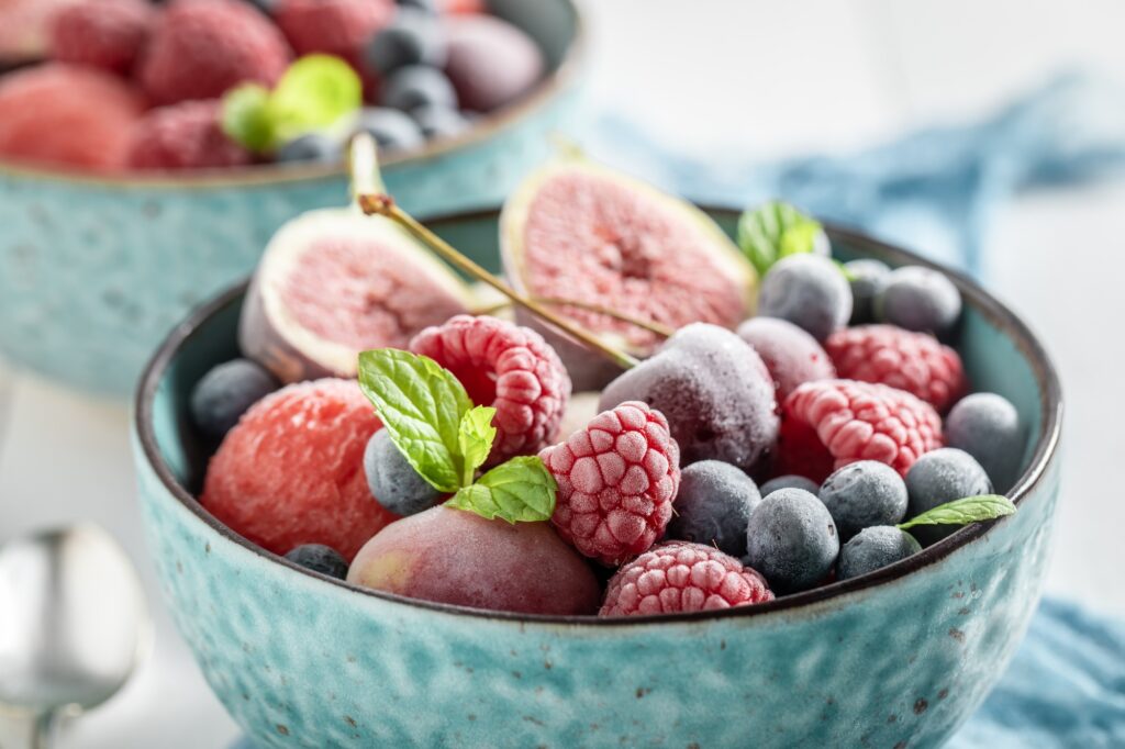 Cold ice cream sorbet with fresh frozen fruits