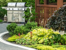 Lush Garden Landscape Featuring Grill Setup in a Backyard