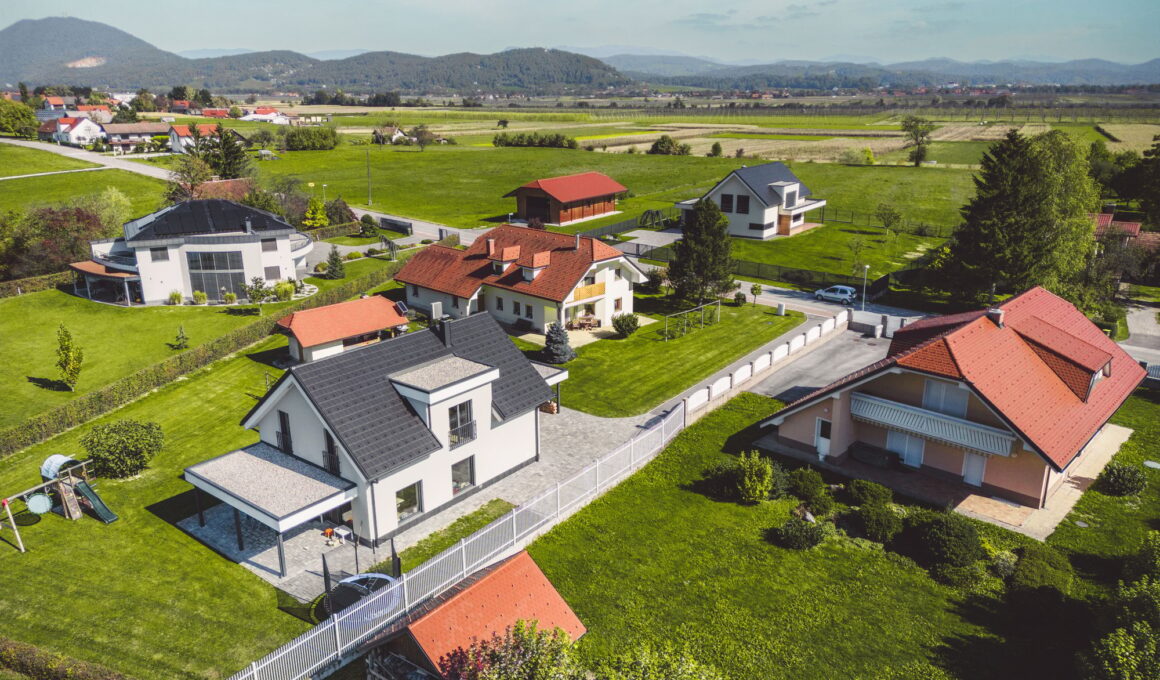 Aerial view of modern houses, family homes in the countryside with big backyards