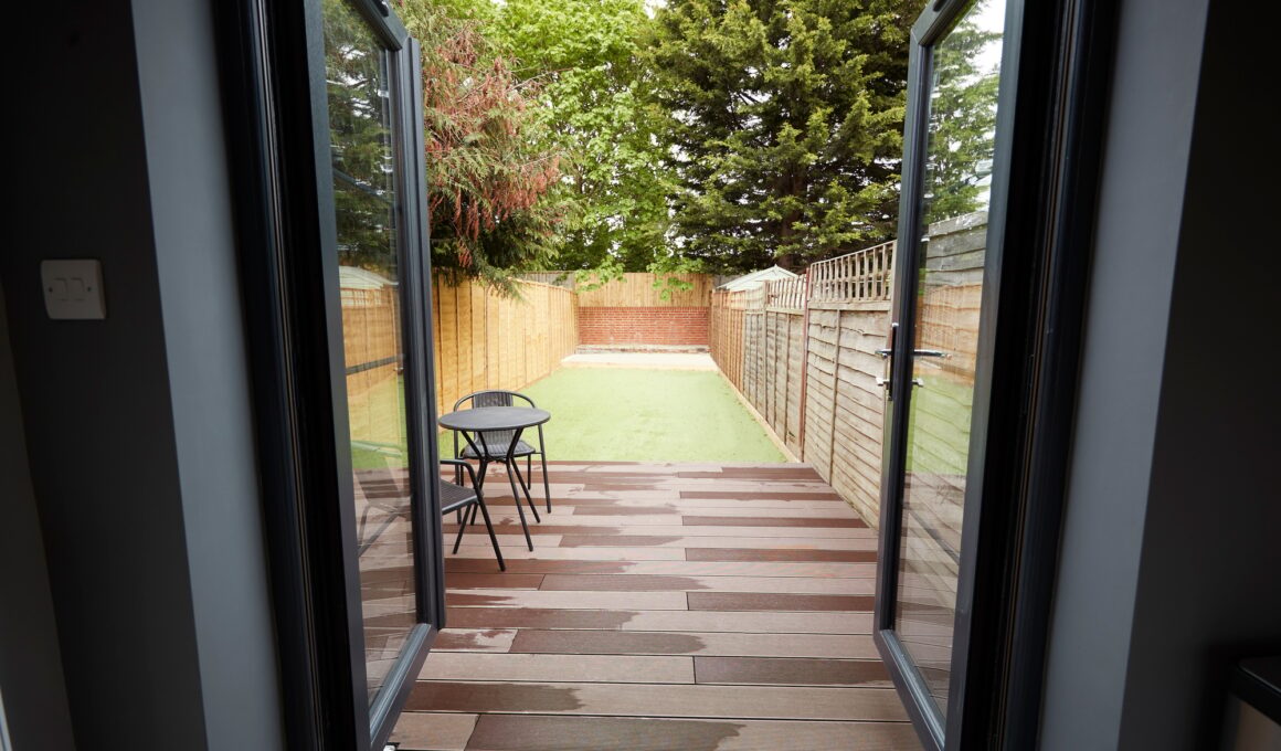 View to the garden from the back door of a refurbished house