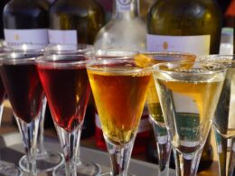 a group of glasses with liquid in them