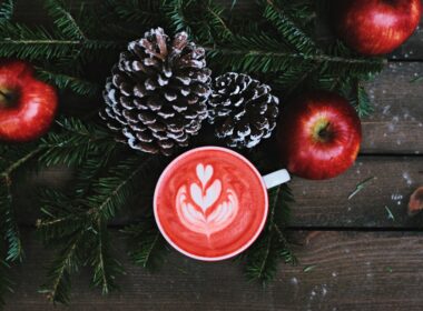 red coffee latte on white ceramic mug