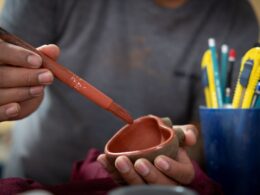 a person painting a heart