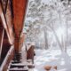 a snow covered staircase leading to a cabin