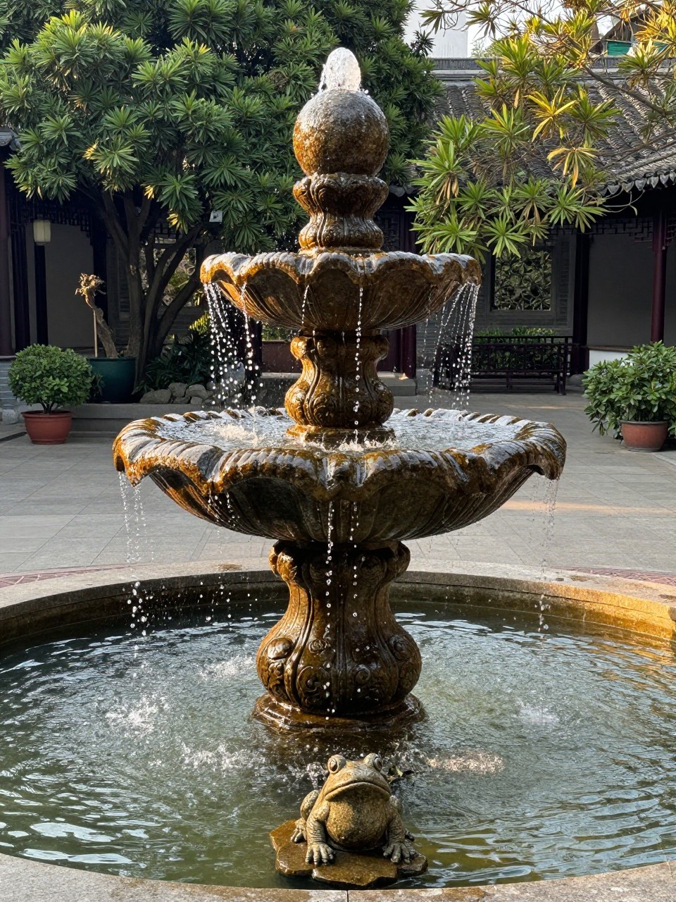 Photo of a stacked stone sphere fountain with water flowing over the spheres, straight-on view, setting in a central courtyard garden, golden hour, containing a small stone frog near the base, iPhone photo quality.